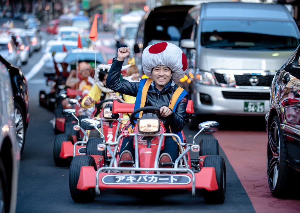 TOKYO, JAPAN - NOVEMBER 16:  Participants drive around Tokyo in Mario Kart characters for the Real Mario Kart event in Tokyo on November 16, 2014 in Tokyo, Japan. The organizer calls for participants to this event held about once a month on Facebook, and Akiba Kart offers rental karts that can be driven on public streets.  (Photo by Keith Tsuji/Getty Images) ORG XMIT: 522846165